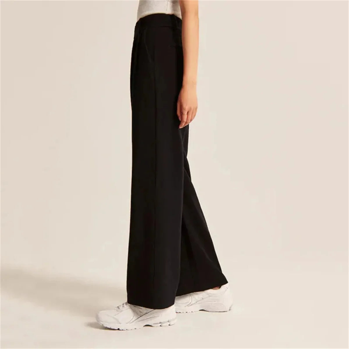 Side view of Black High-Waisted Palazzo Pants with wide-leg fit for an elegant, office-ready look.