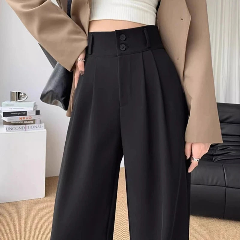 Zoomed-in view of Black High-Waisted Wide-Leg Suit Trousers, focusing on stitching and fabric details.