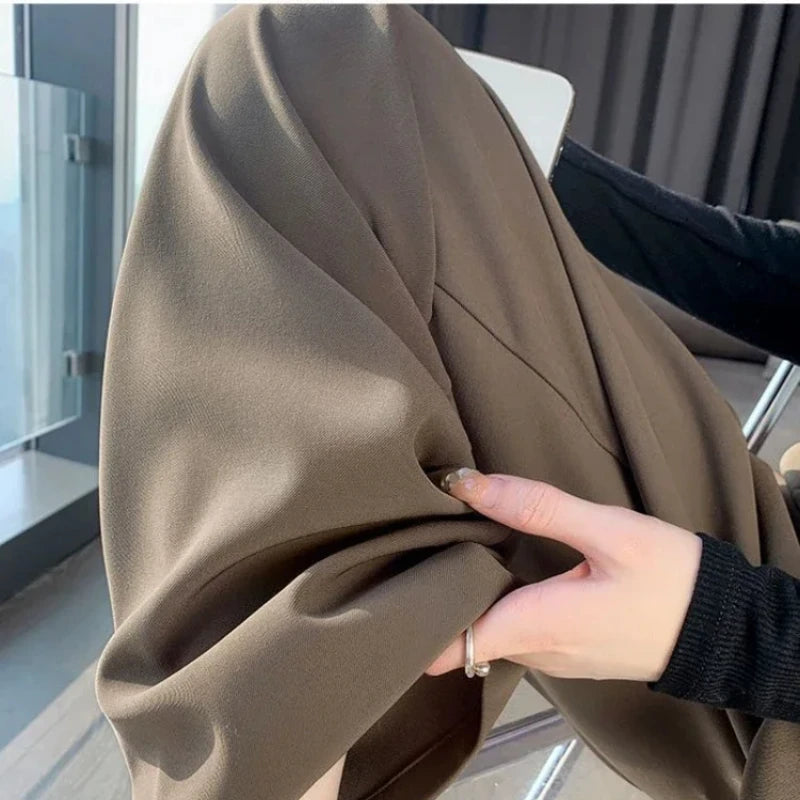 Close-up of the fabric texture of Coffee High-Waisted Wide-Leg Suit Trousers, emphasizing high-quality material.