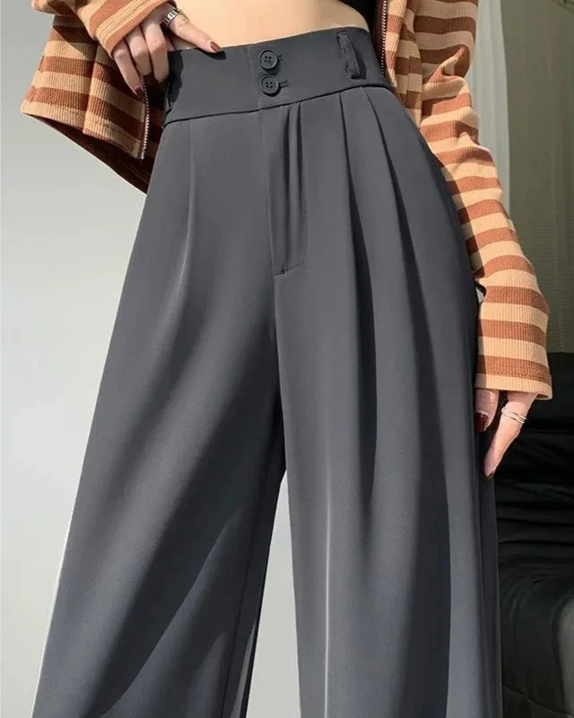 Zoomed-in view of Grey High-Waisted Wide-Leg Suit Trousers, highlighting details like seams and fit.