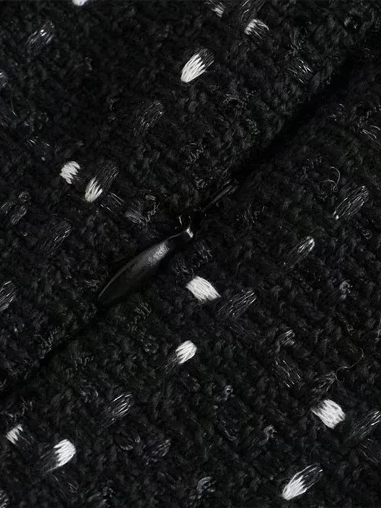 Stylish black tweed dress for festive events and sophisticated gatherings.