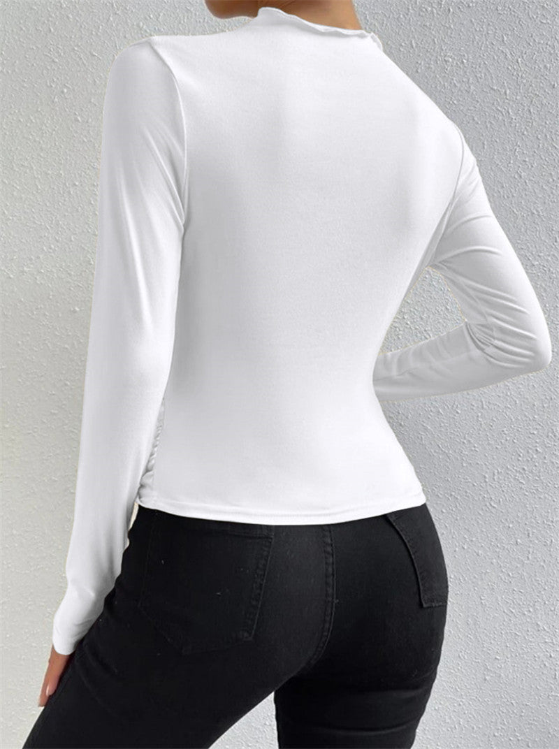 Modern chic ivory pleated t-shirt, blending old-money style with seasonal trends.