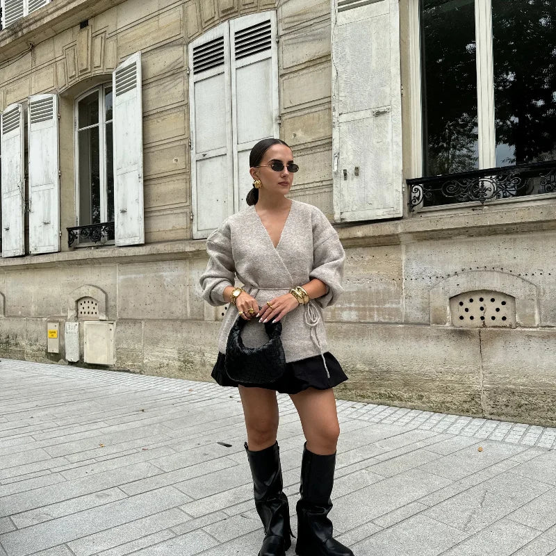 Cozy khaki cardigan with a lace-up belt design, perfect for modern winter outfits.