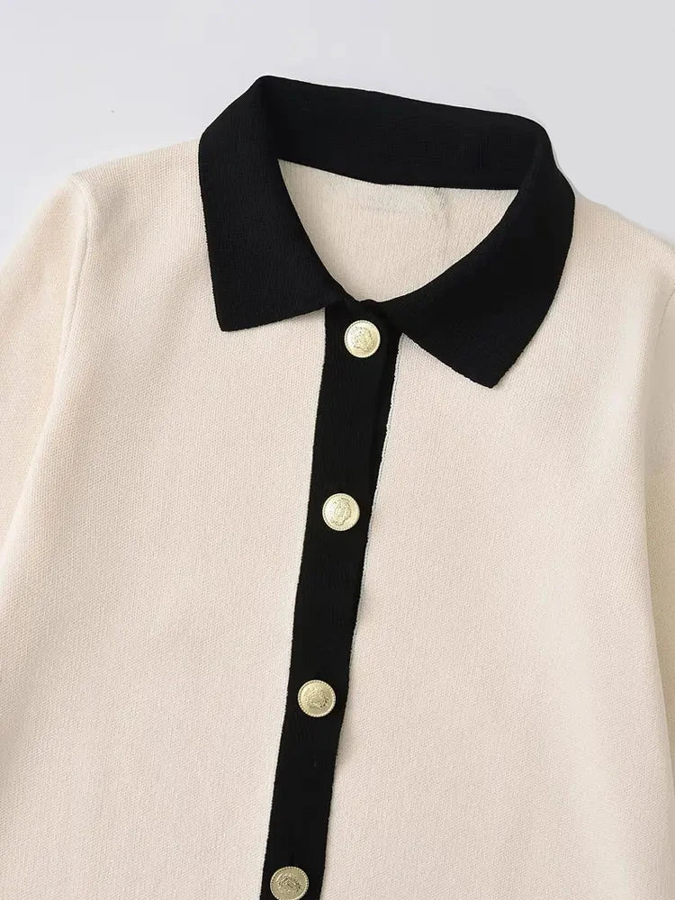 Sophisticated office-ready knitted mini dress in cream beige with black details and gold buttons for a polished look
