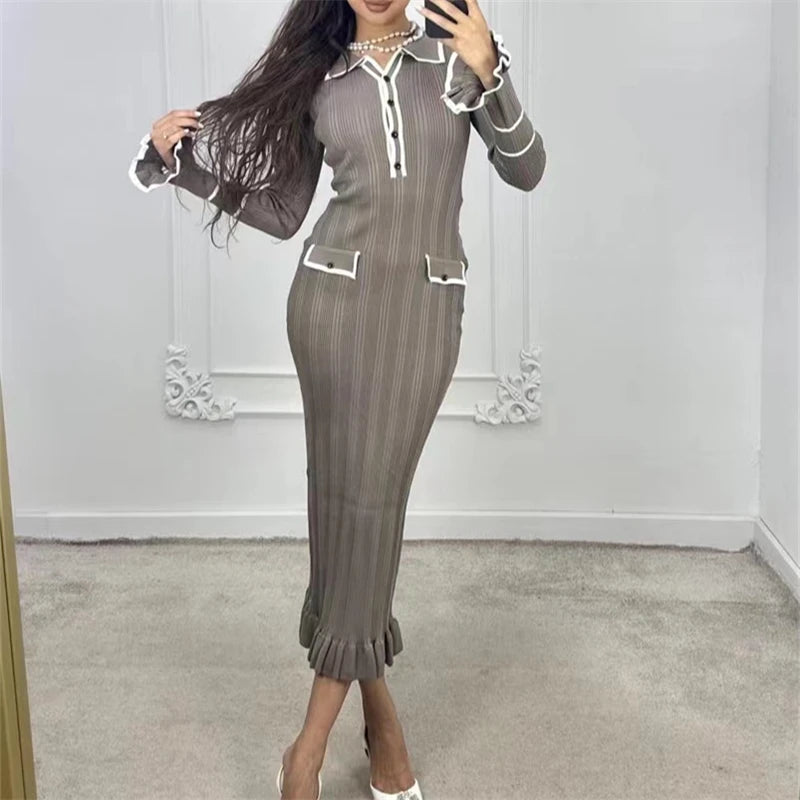 Neutral camel-toned knitted ruffle midi dress, offering timeless and stylish appeal