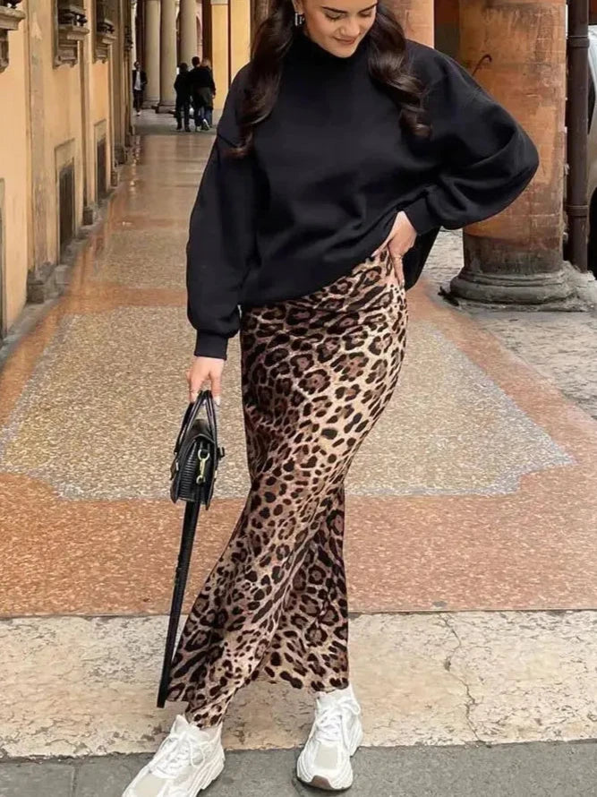Leopard print midi skirt with bold animal print, perfect for chic and trendy outfits.