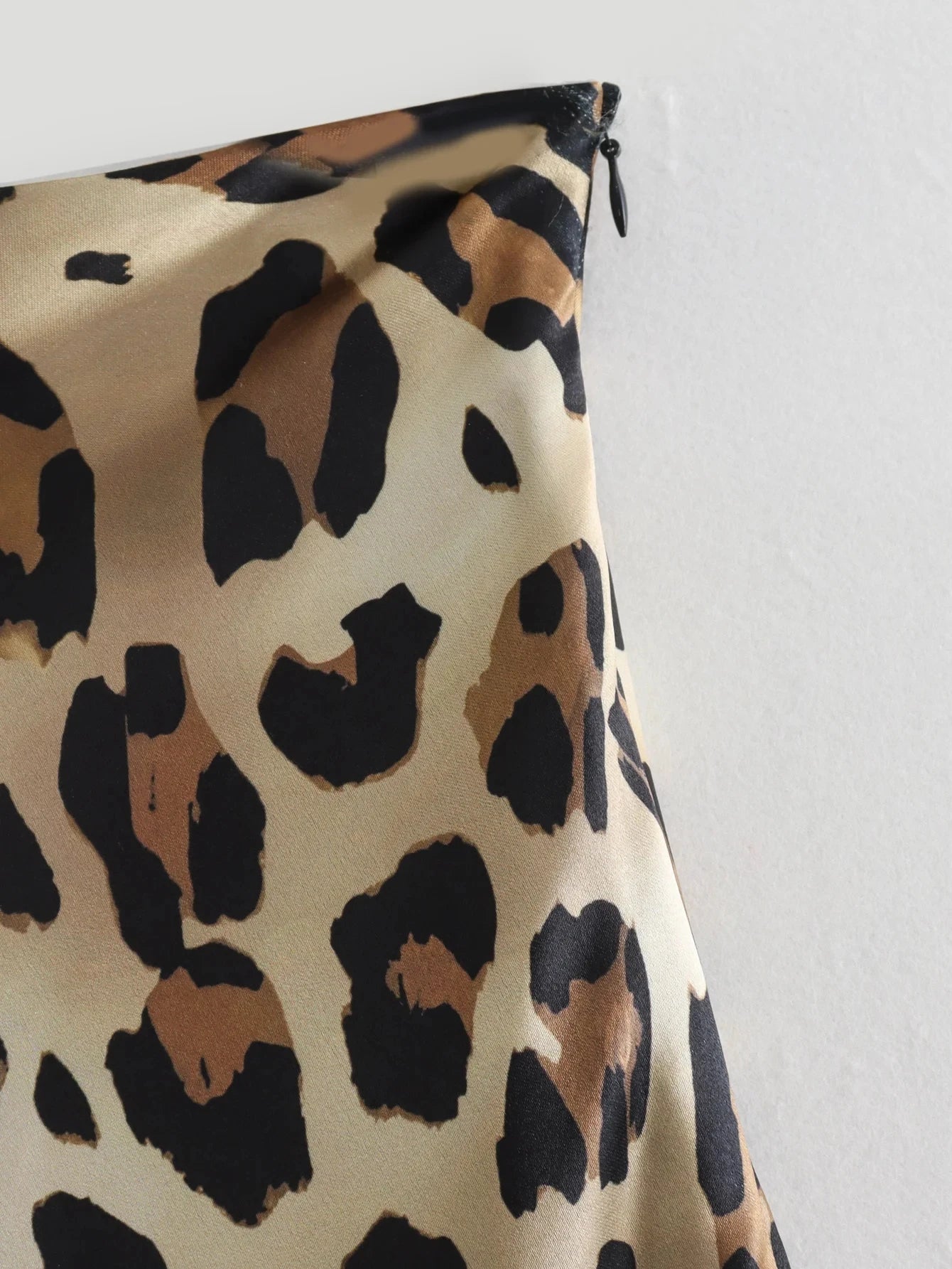 Classy leopard print midi skirt, a statement piece for day-to-night elegance.
