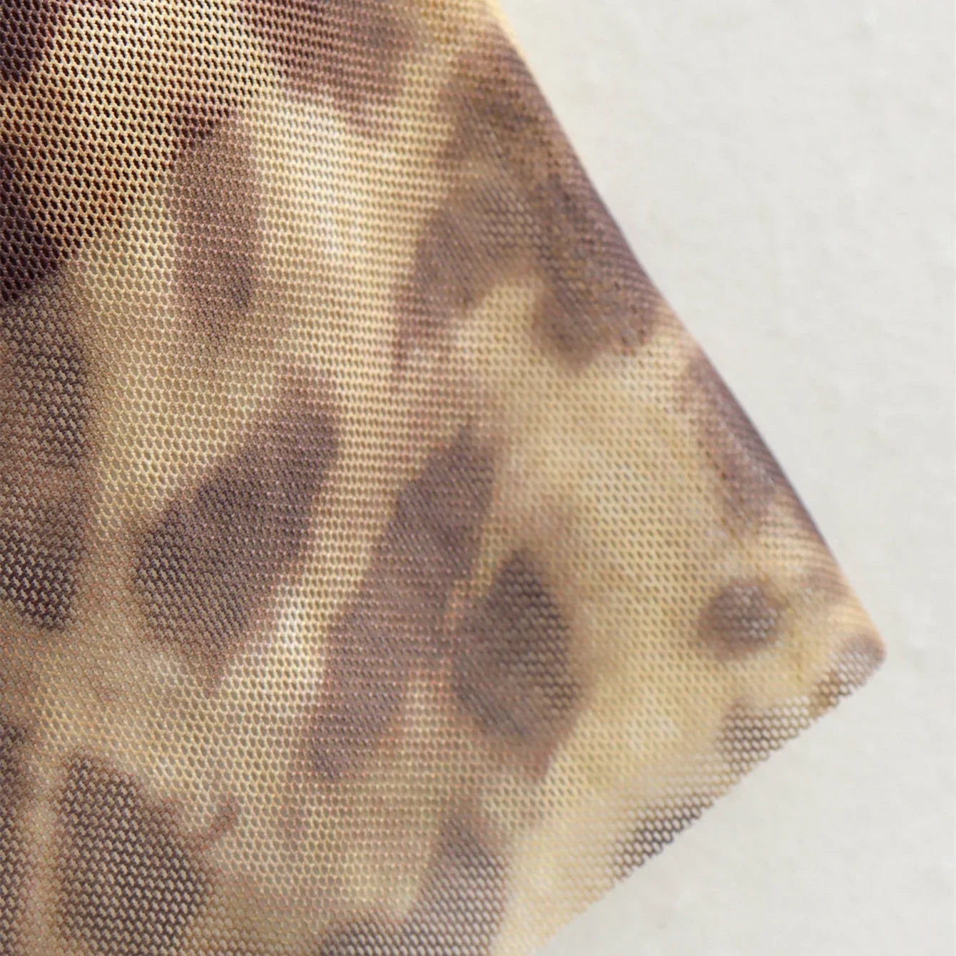 Versatile leopard tulle midi skirt, effortlessly styled for day-to-night looks.