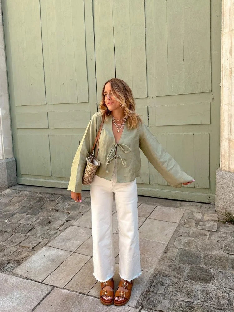Green linen lace-up blouse, ideal for spring and summer fashion.