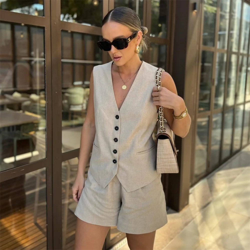 Lightweight beige linen set with a vest and high-waist shorts for casual elegance.