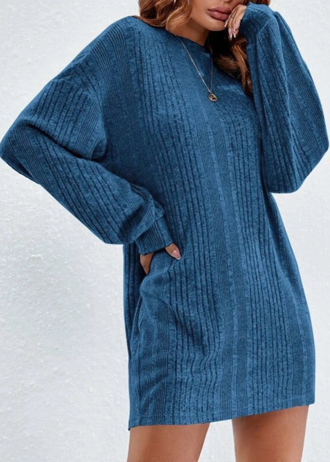 Blue long sleeve knitted sweater dress, featuring a chic and elegant style.