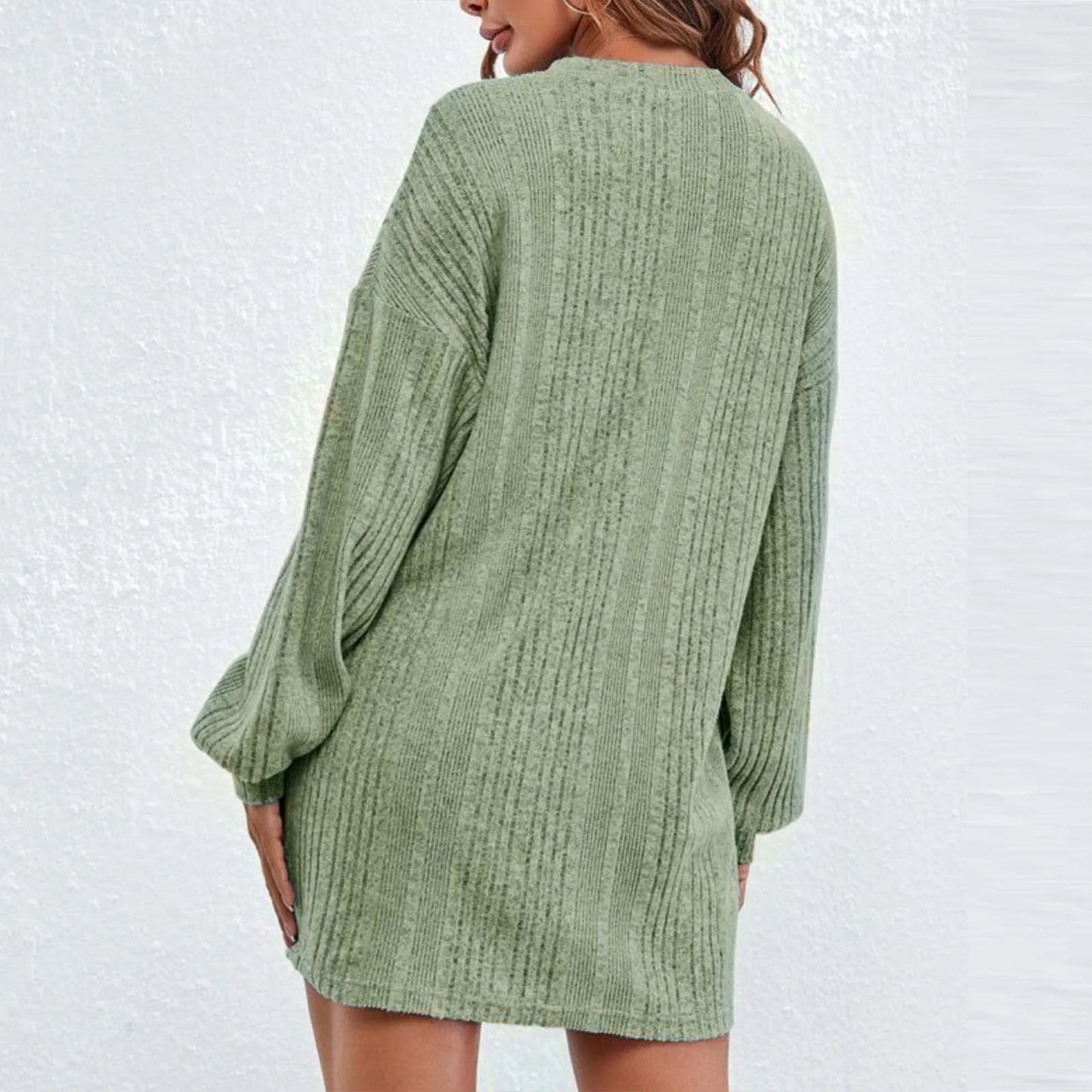 Green long sleeve knitted sweater dress, a modern and versatile wardrobe piece.