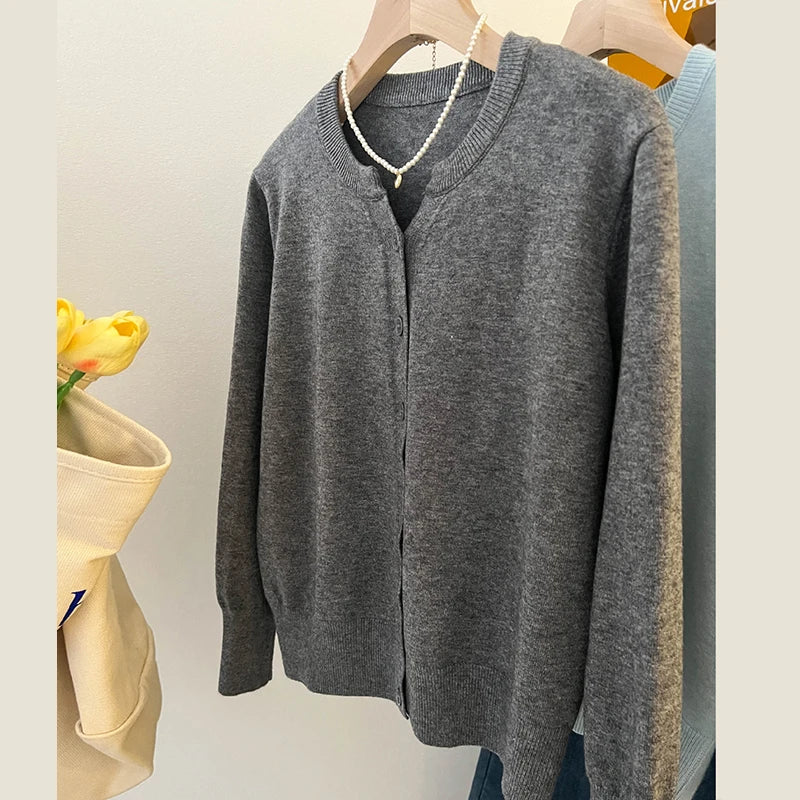 Casual grey cardigan with a loose knit design for effortless layering.