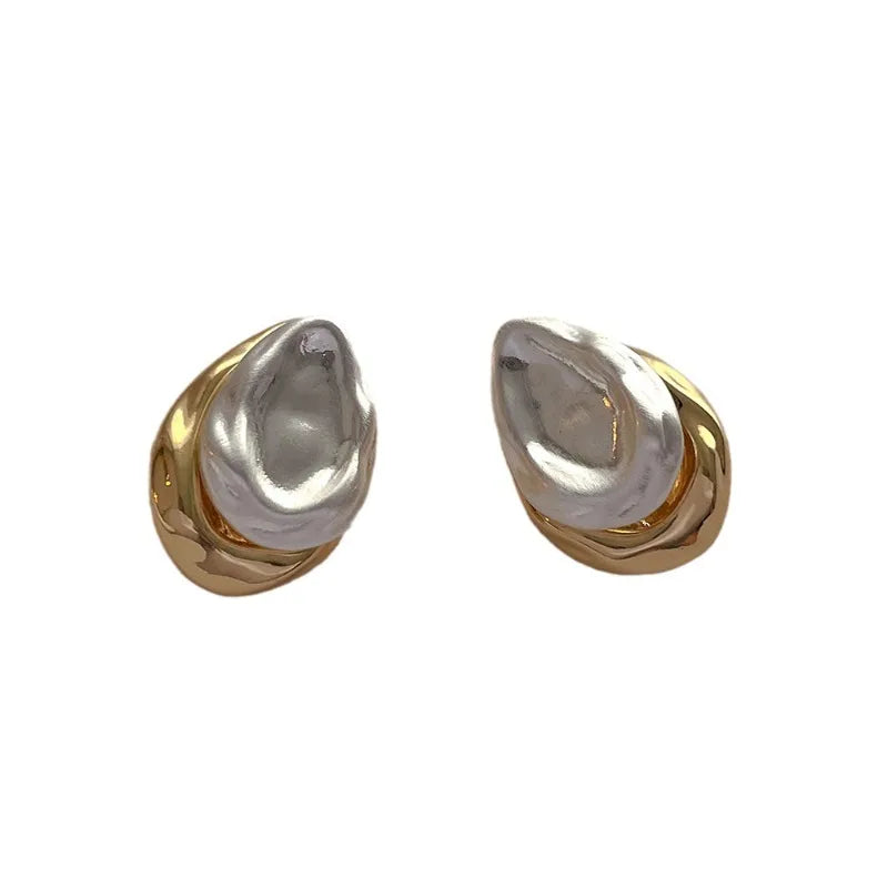 Mixed silver and gold teardrop earrings, blending classic charm with modern elegance