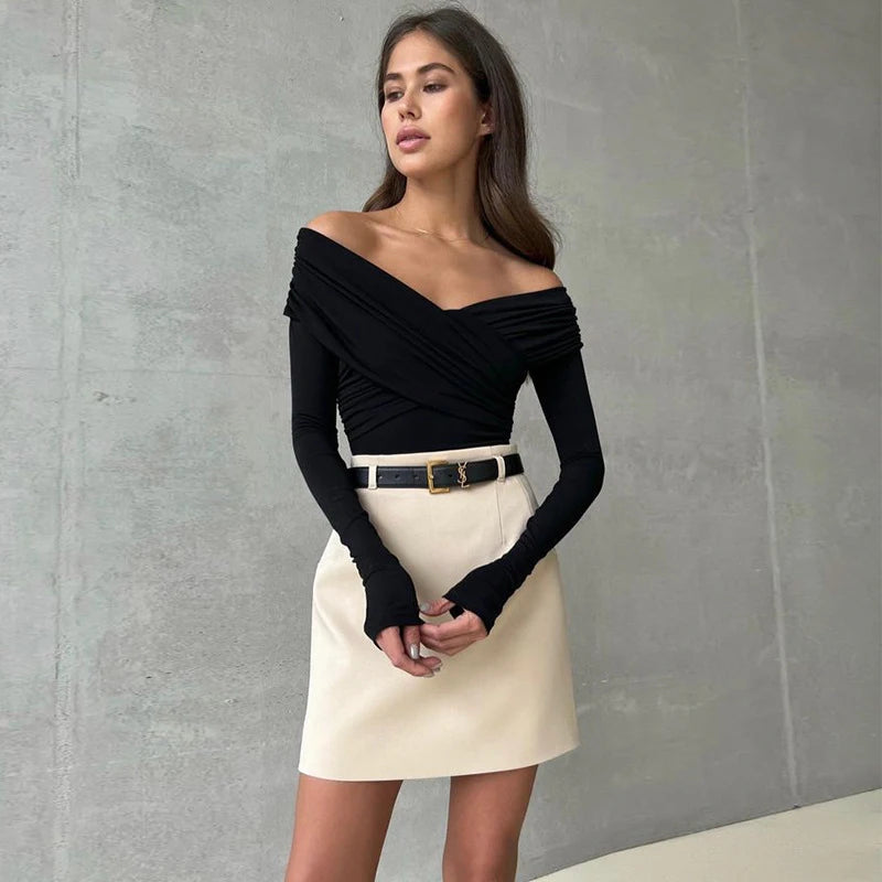 Fashionable black corset bodysuit with an off-shoulder design, versatile for any look.