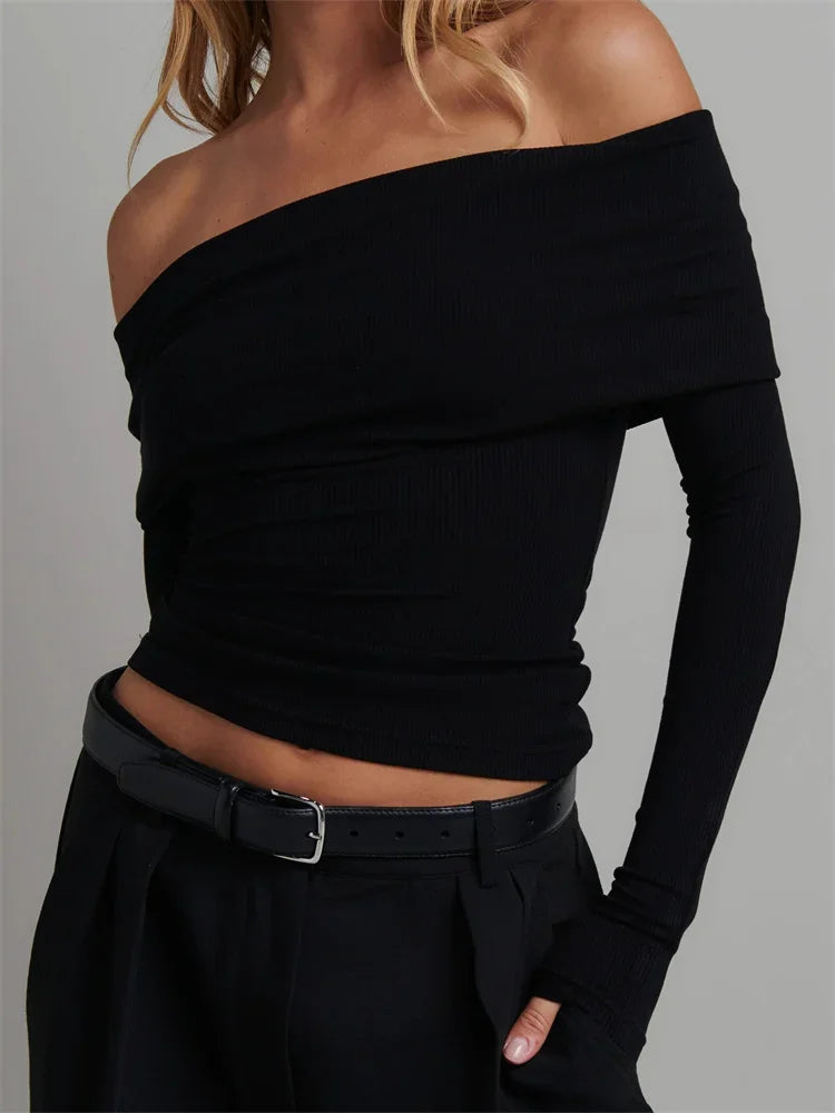 Front view of Black Off-Shoulder Long Sleeve Knitted Tee showcasing the trendy slash neck design
