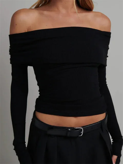 Black Off-Shoulder Long Sleeve Knitted Tee showcasing the trendy slash neck design.