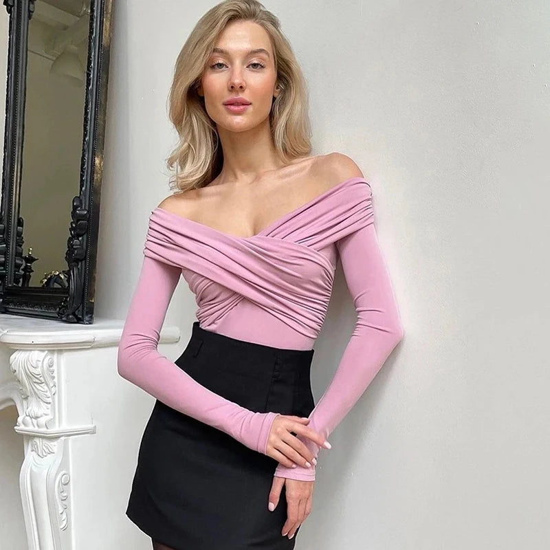 Trendy pink off-shoulder corset bodysuit, ideal for stylish and contemporary wardrobes.