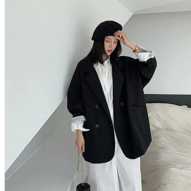 Oversized blazer coat in black, embodying classic sophistication with a modern edge.