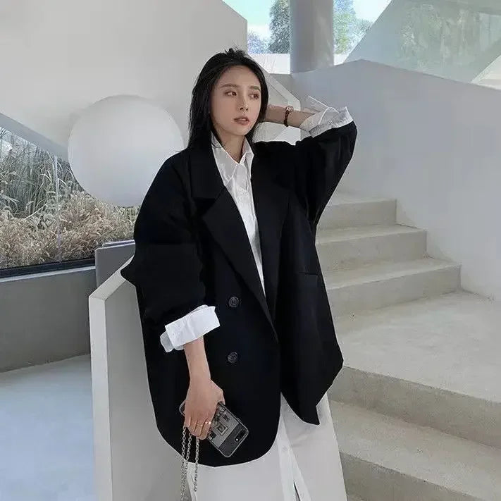 Black oversized blazer showcasing a luxurious, old-money-inspired aesthetic.