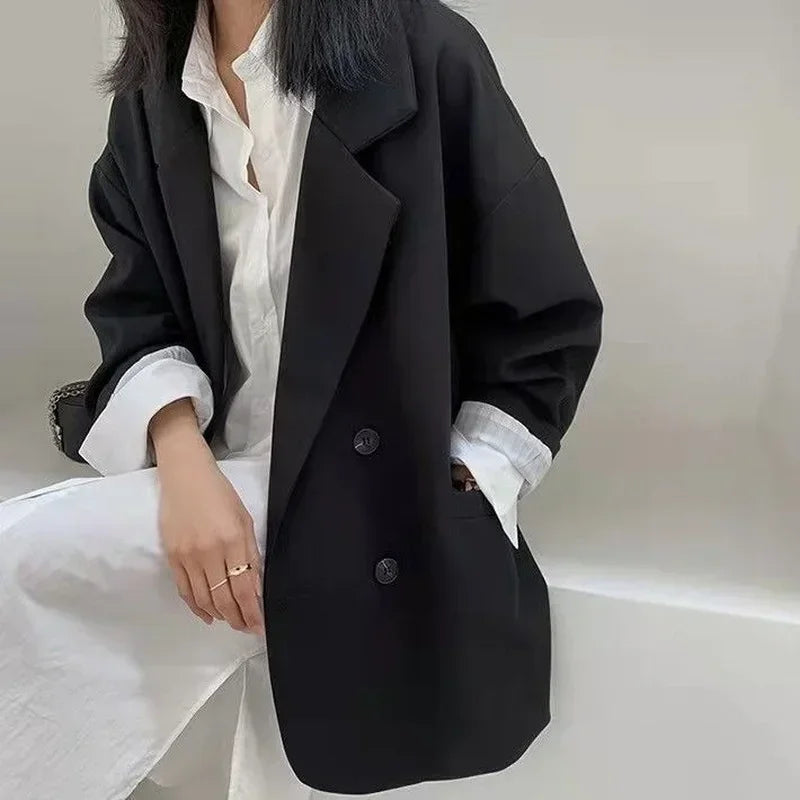 Black oversized blazer coat styled for a modern, trend-focused look.
