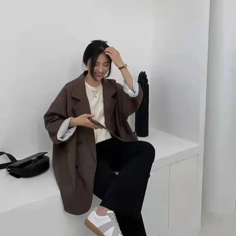Brown oversized blazer coat styled with neutral tones for a polished outfit.