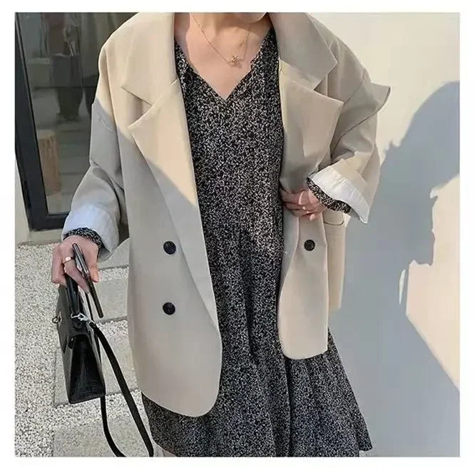 Oversized blazer coat in creamy-white, adding a touch of elegance to any outfit.