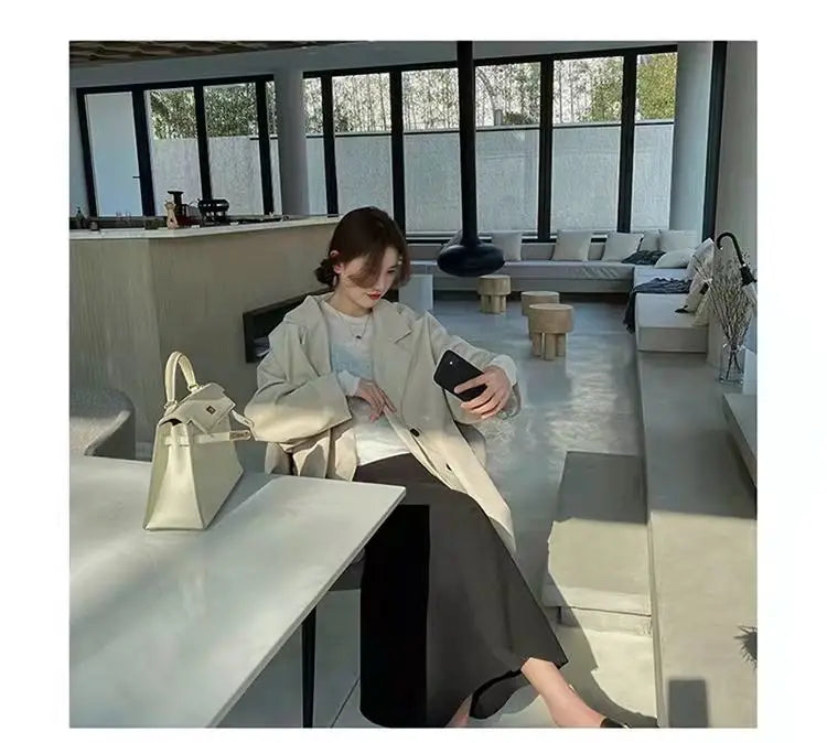 Creamy-white oversized blazer coat styled for modern sophistication.
