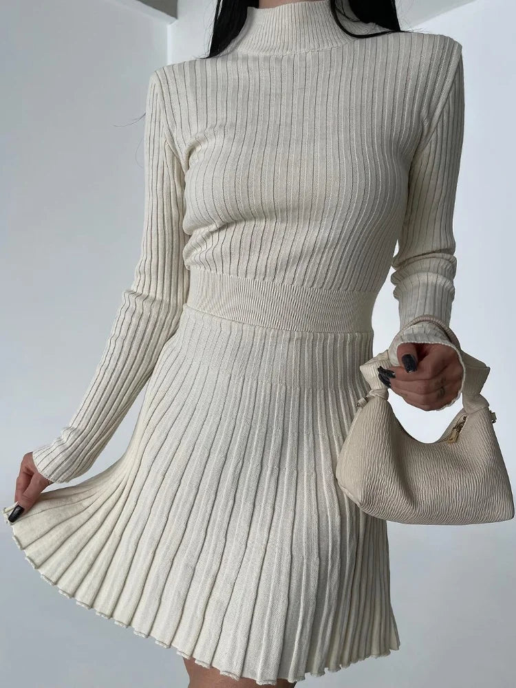 Pleated mini dress in beige, ideal for creating a modern and stylish outfit.