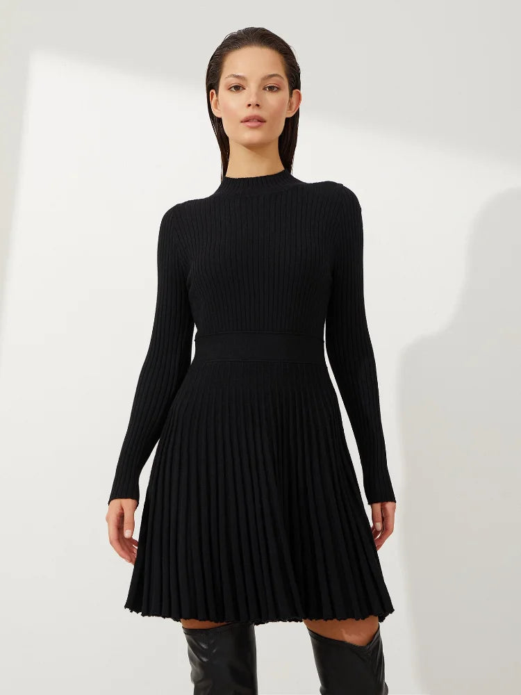 Pleated mini dress in black, blending modern trends with timeless fashion.
