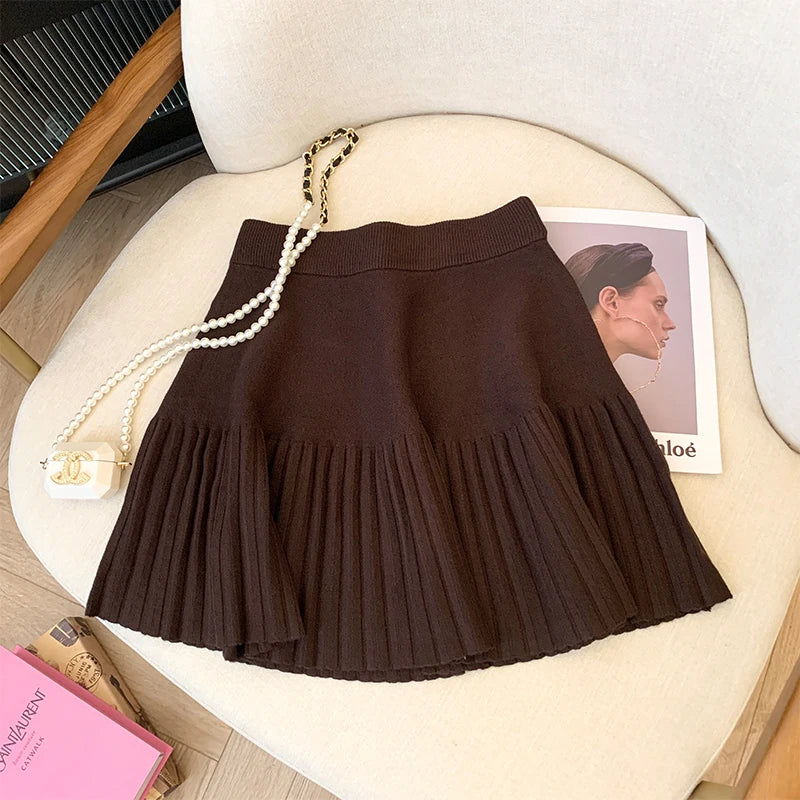 Coffee Pleated Mini Skirt shown against a chic background, suitable for various occasions.
