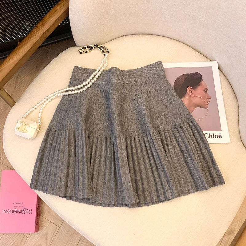Grey Pleated Mini Skirt against a stylish background, ideal for casual and dressy occasions.