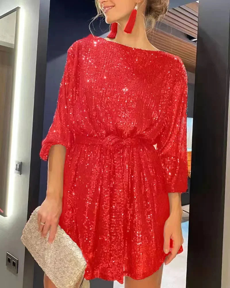 Red sparkling beaded mini dress with slash neckline, perfect for holiday parties and festive celebrations.
