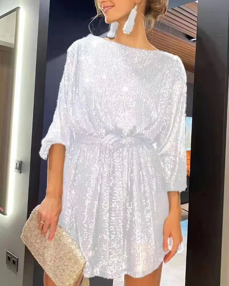 Chic silver sparkling beaded mini dress for an elegant evening look, featuring a straight silhouette