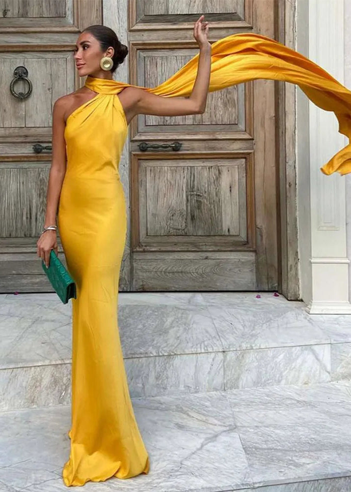 Yellow halter neck dress with flowing ribbon detail