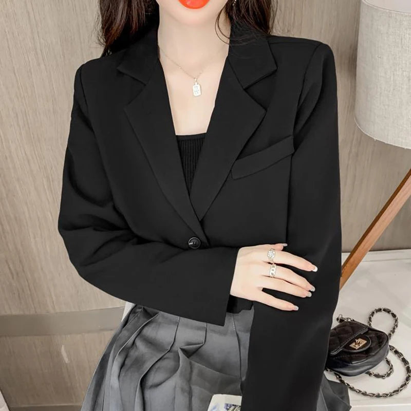 Sophisticated black cropped blazer perfect for winter fashion and office elegance