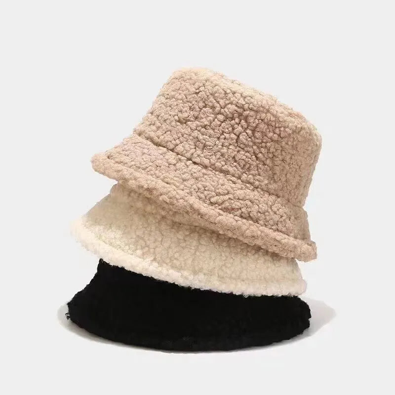 Teddy bucket hats in black, beige, and white, showcasing versatile fashion styles.