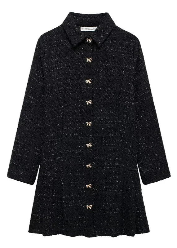 Elegant tweed mini dress in black with bow-shaped buttons, perfect for chic winter gatherings and festive occasions.
