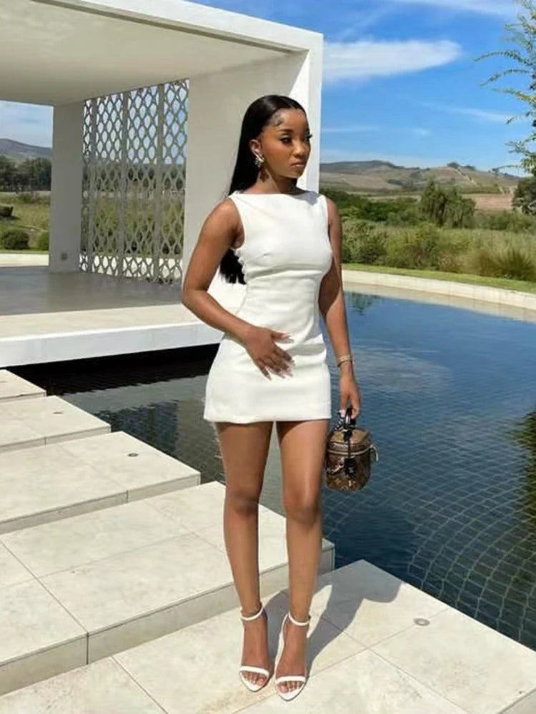 White sleeveless mini bodycon dress, perfect for a chic and casual streetwear look, offering comfort and style.