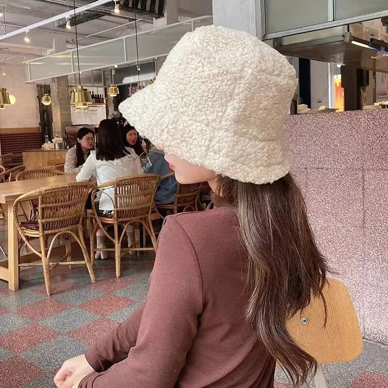 Soft white teddy bucket hat with a fuzzy texture for stylish seasonal outfits