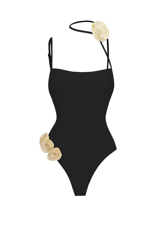 Black swimsuit with floral details on a white background