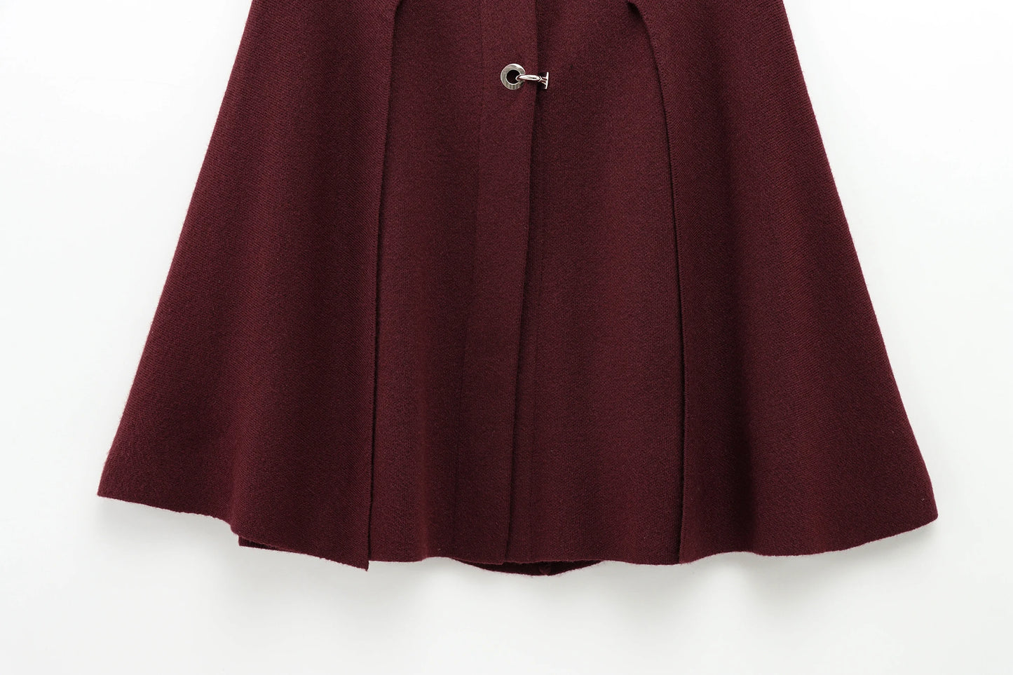 Burgundy cape with a button on a white background