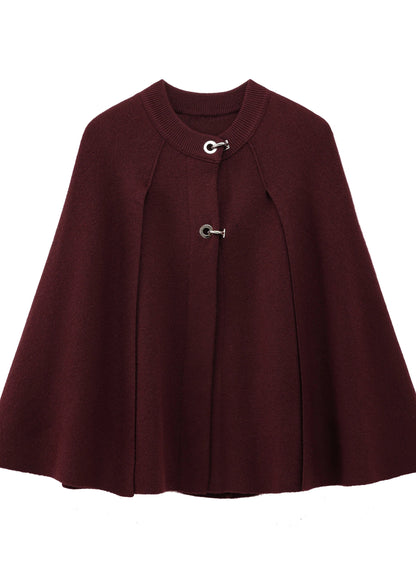 Burgundy cape with silver buttons on a white background