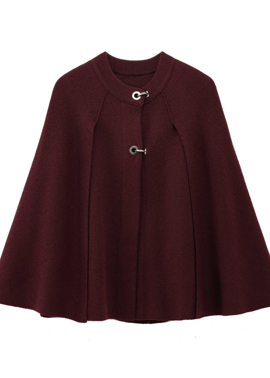 Burgundy cape with silver buttons on a white background