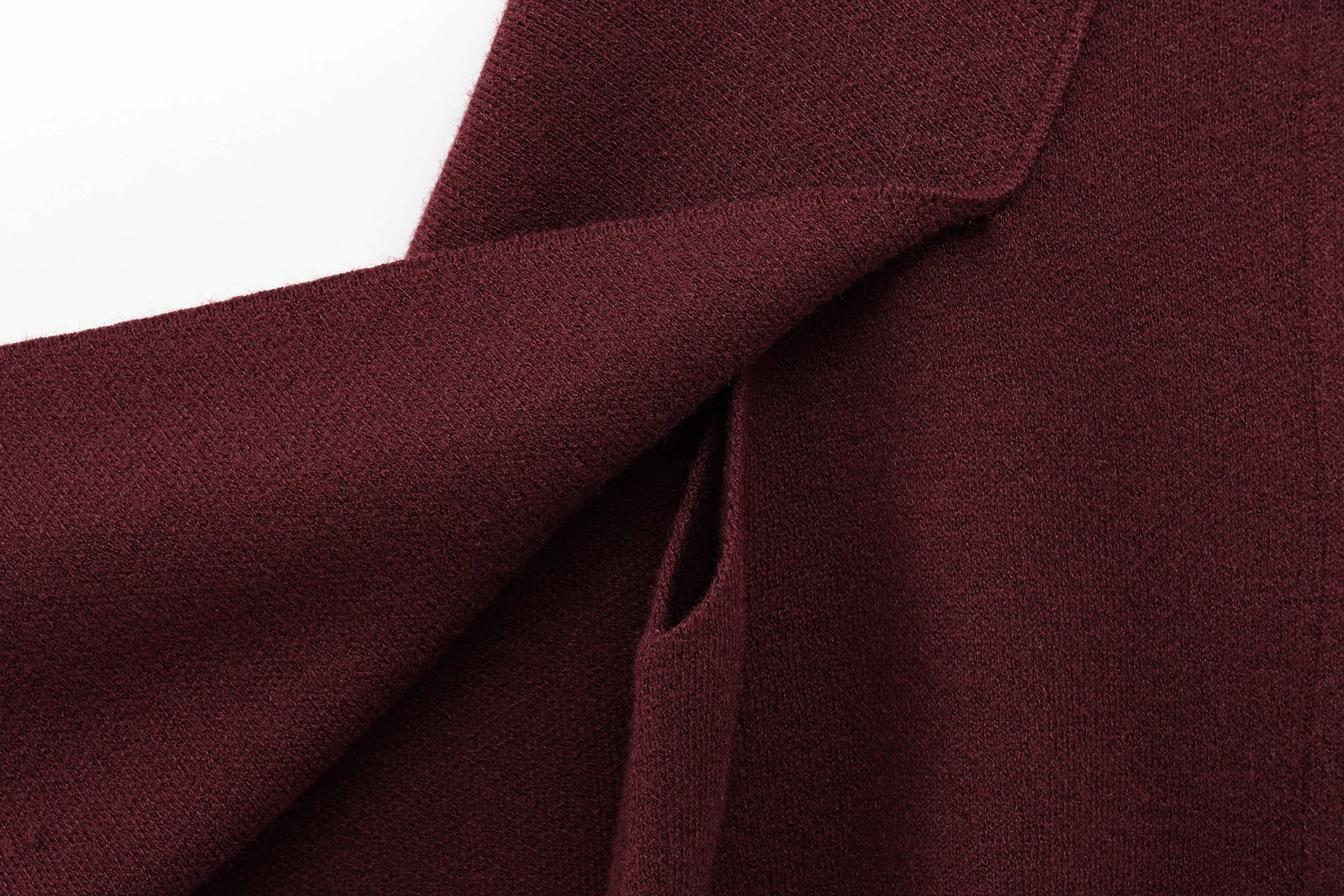 Close-up of Burgundy cape with a white background