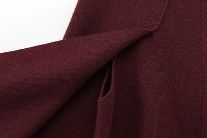 Close-up of Burgundy cape with a white background