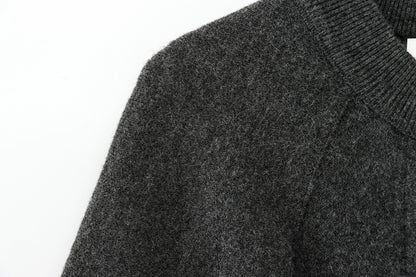 Close-up of a dark gray cape on a white background