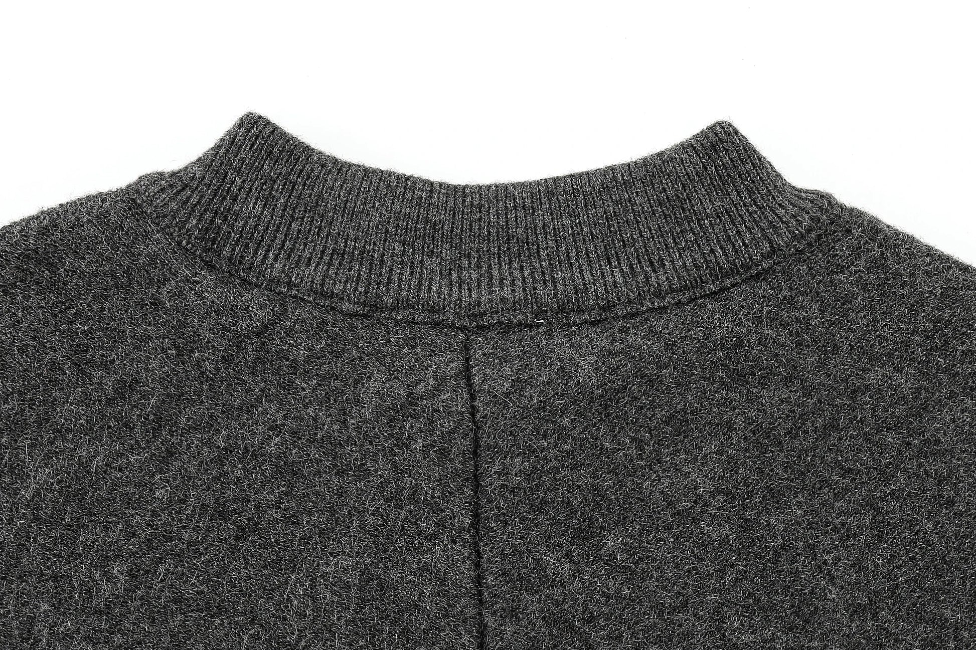 Close-up of a dark gray cape with a ribbed neckline on a white background