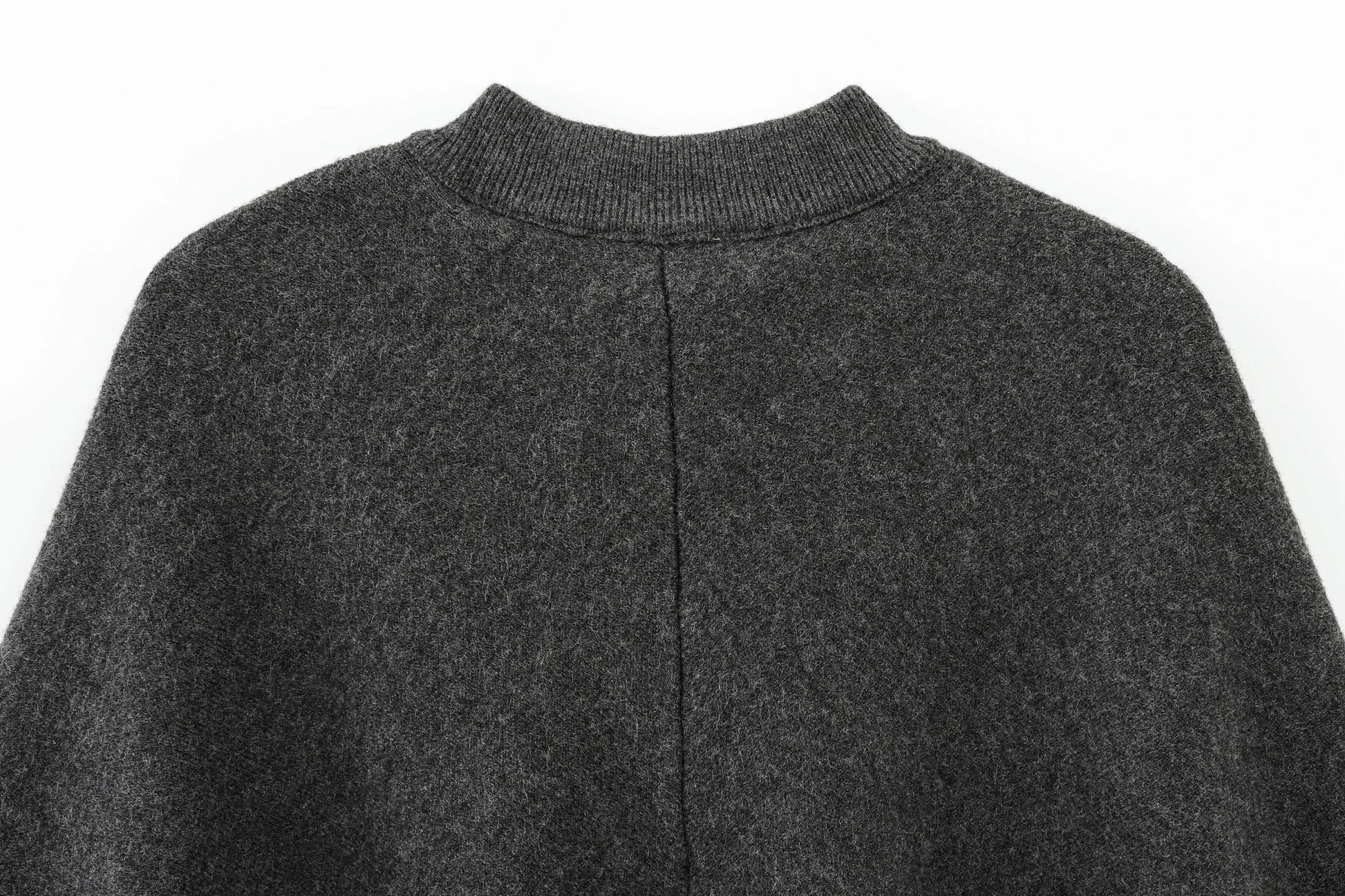 Dark gray cape with a close-up of the collar on a white background