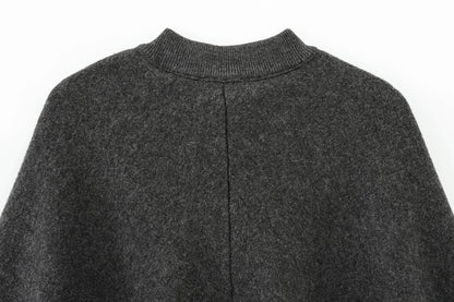 Dark gray cape with a close-up of the collar on a white background